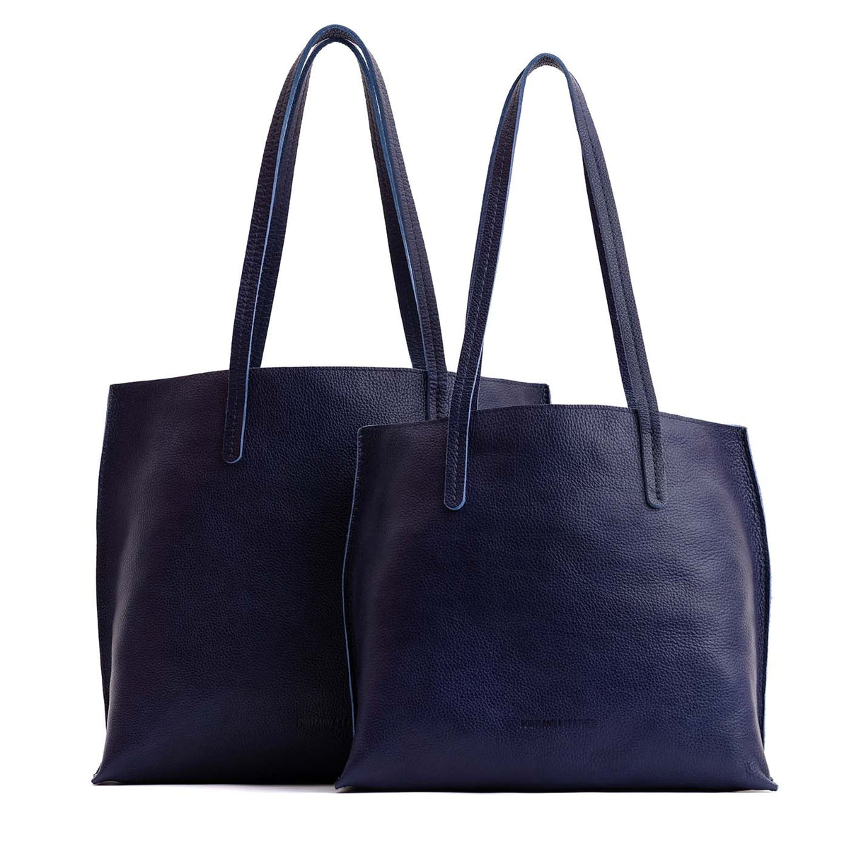 Cobalt | Side by side comparison of both sizes of leather totes