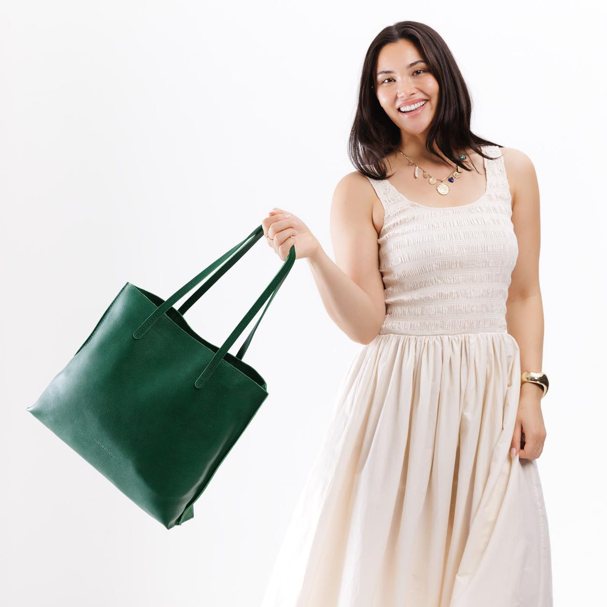 Bacalar*Large | Model holding leather tote bag with interior snap key loop