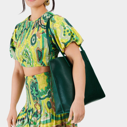 Forest Green*Large | Model holding leather tote bag with interior snap key loop