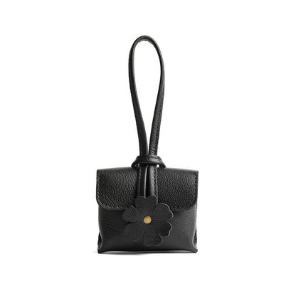 Pebbled--black | Wristlet pouch with loop strap and a flower design