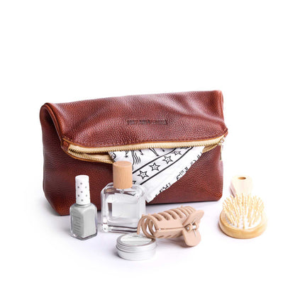 Nutmeg | Closed folded zipper pouch with items