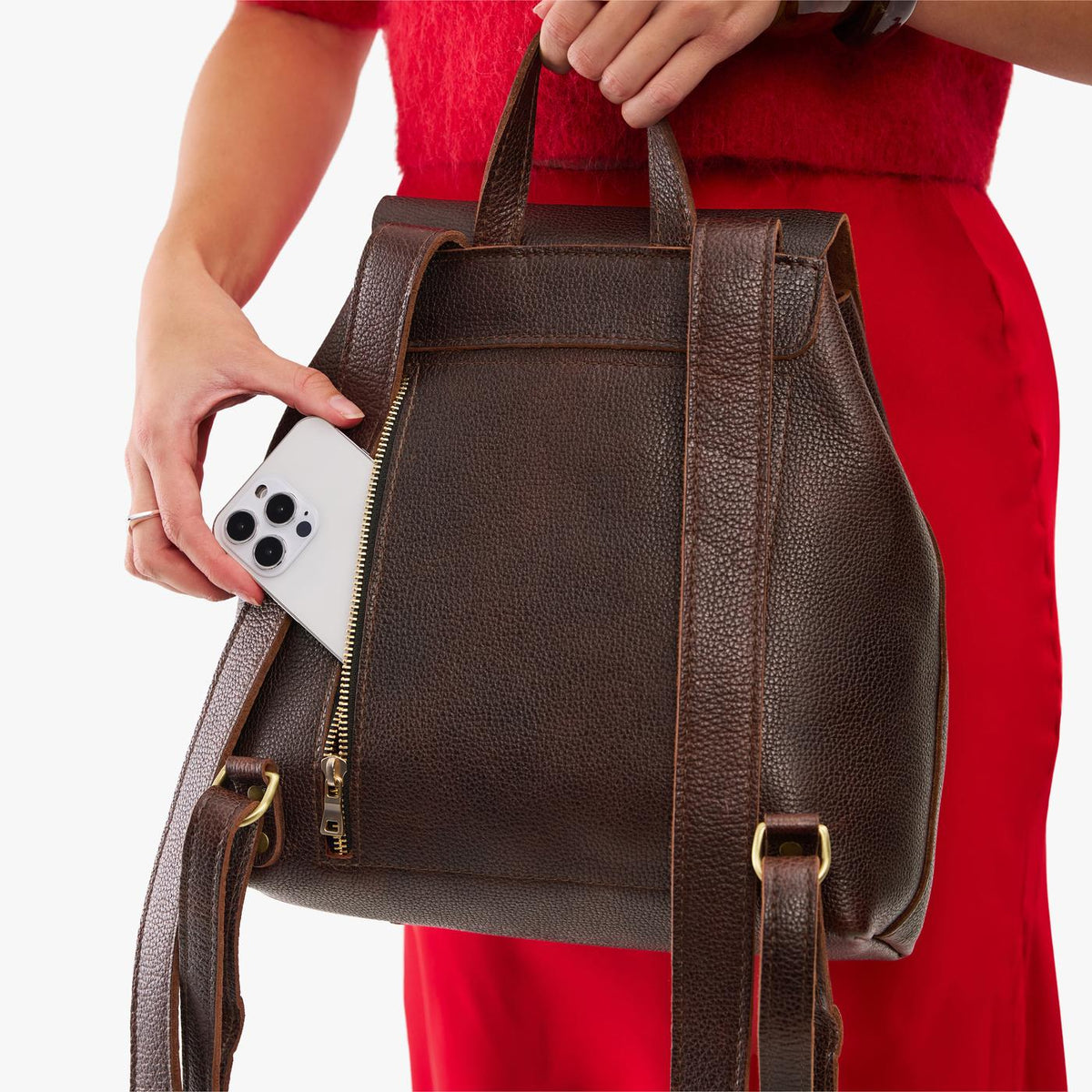 Coldbrew | Model wearing a leather backpack on a white background