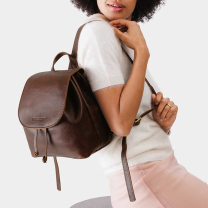 Coldbrew | Pebbled leather drawstring backpack being worn by a person.
