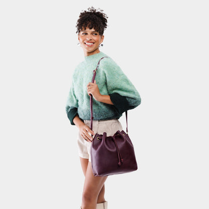 Plum*Large | Model wearing slouchy crossbody bag with drawstring closure