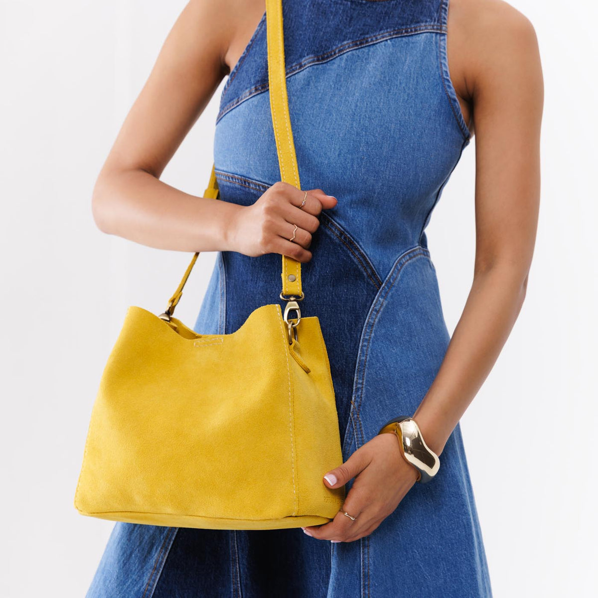 Hello Yellow | symmetrical bucket bag with latch closure and removable crossbody strap