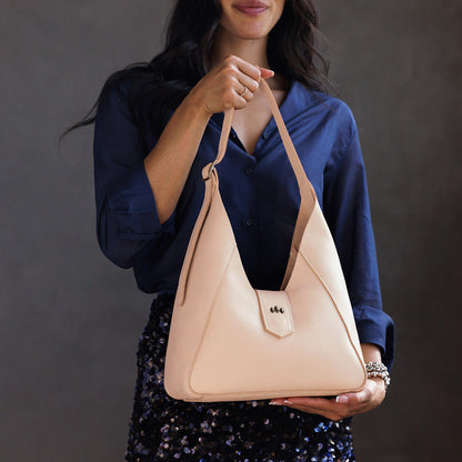 Moonflower | Model wearing structured hobo shoulder bag with adjustable strap and magnetic closure