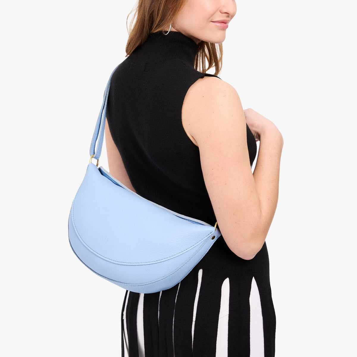 Skyway*Large | Model wearing half circle shaped sling bag