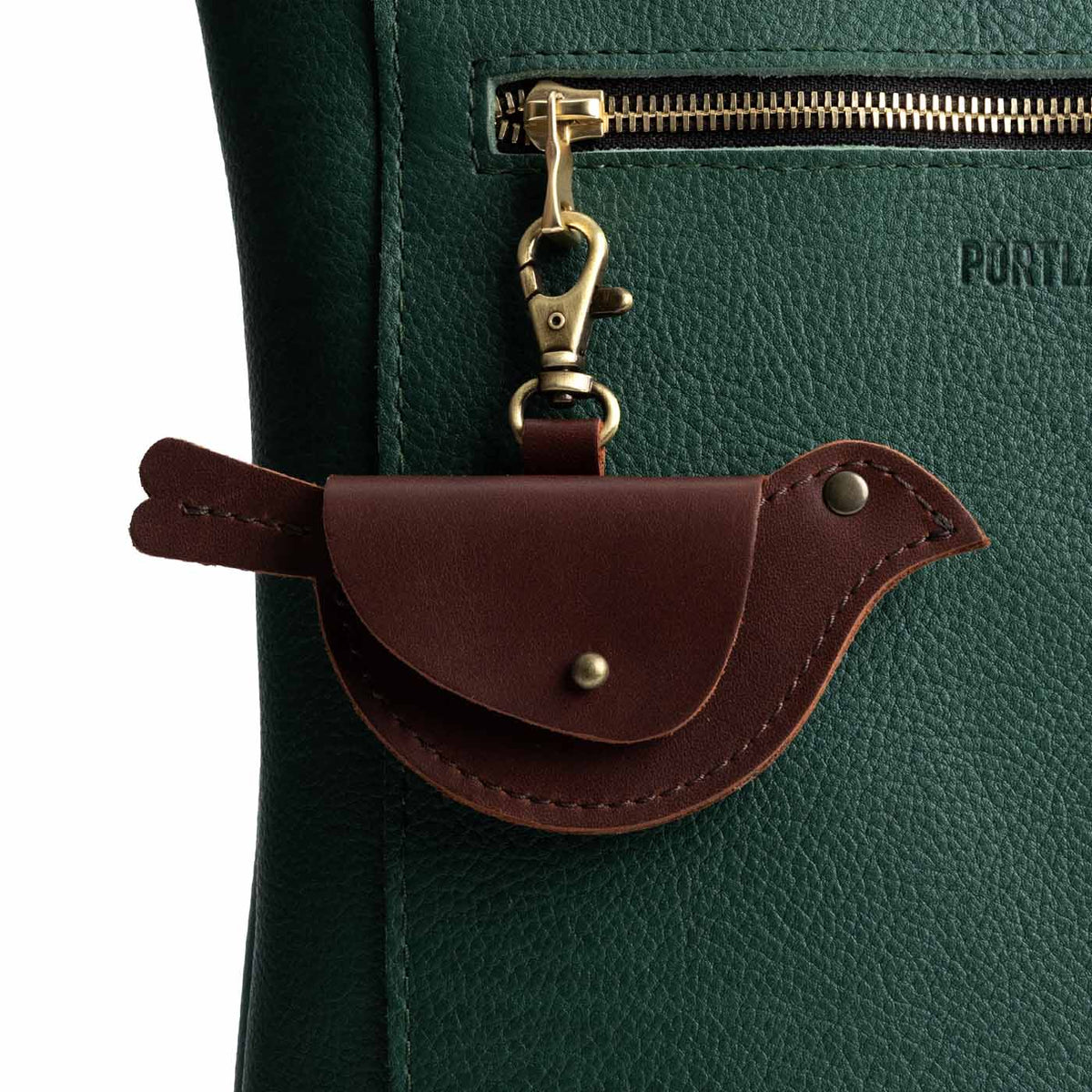 Cognac | Bird shaped pouch with button closure and lobster clasp