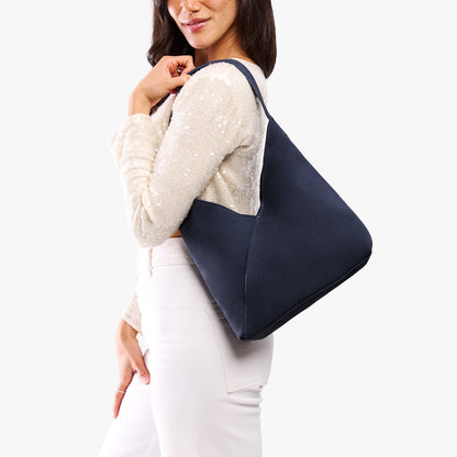 Alaska Blue*Large | Model wearing mid-size shoulder bag with magnetic snap closure