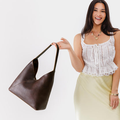 Coldbrew*Oversized | Model wearing large shoulder bag with magnetic snap closure