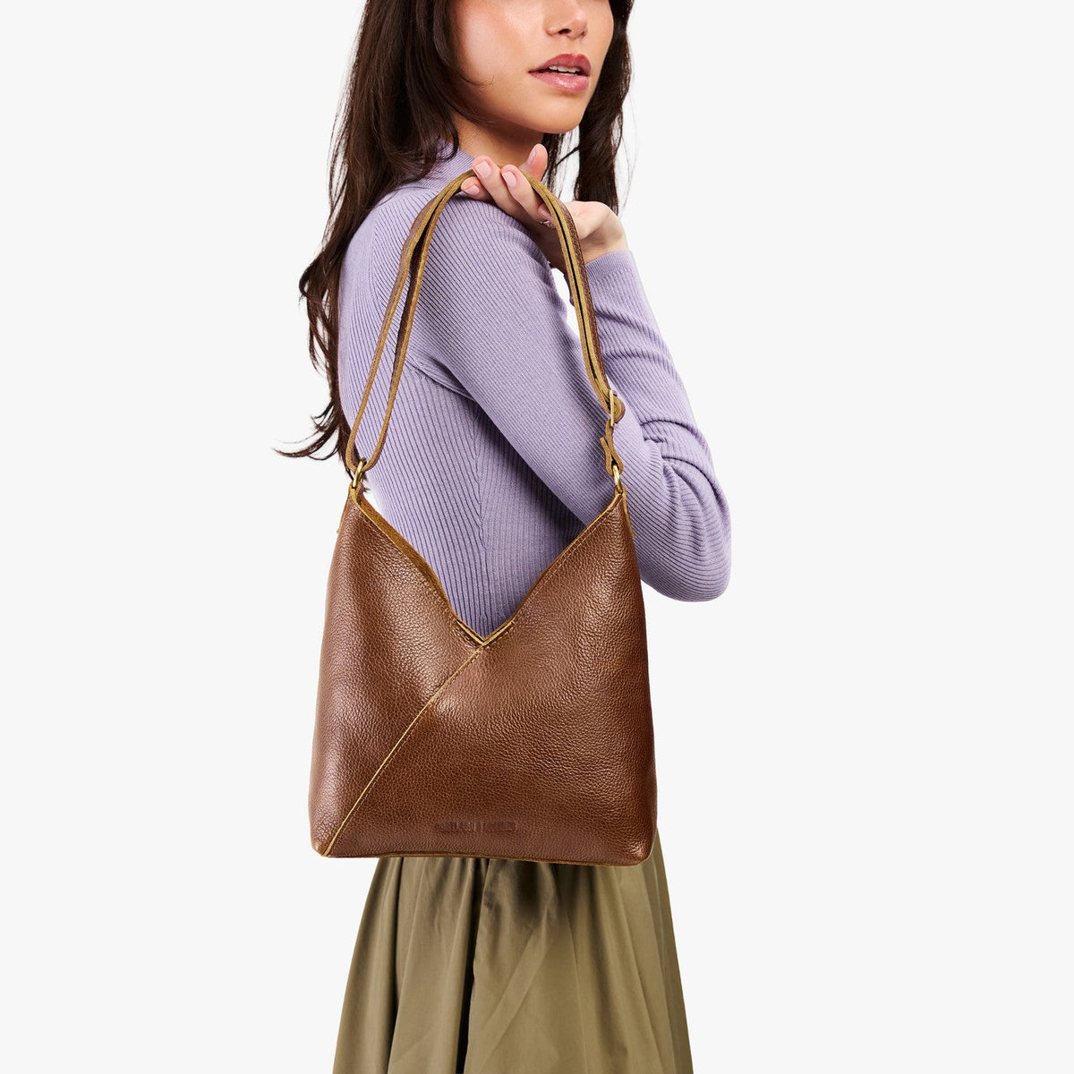 Asheville*Small | Model wearing petite shoulder bag with adjustable strap and magnetic snap closure