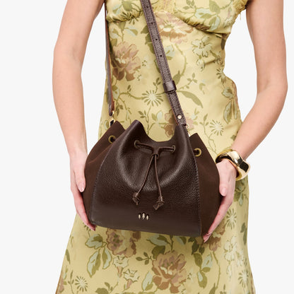 Coldbrew | Model wearing bucket bag with cinched drawstring closure