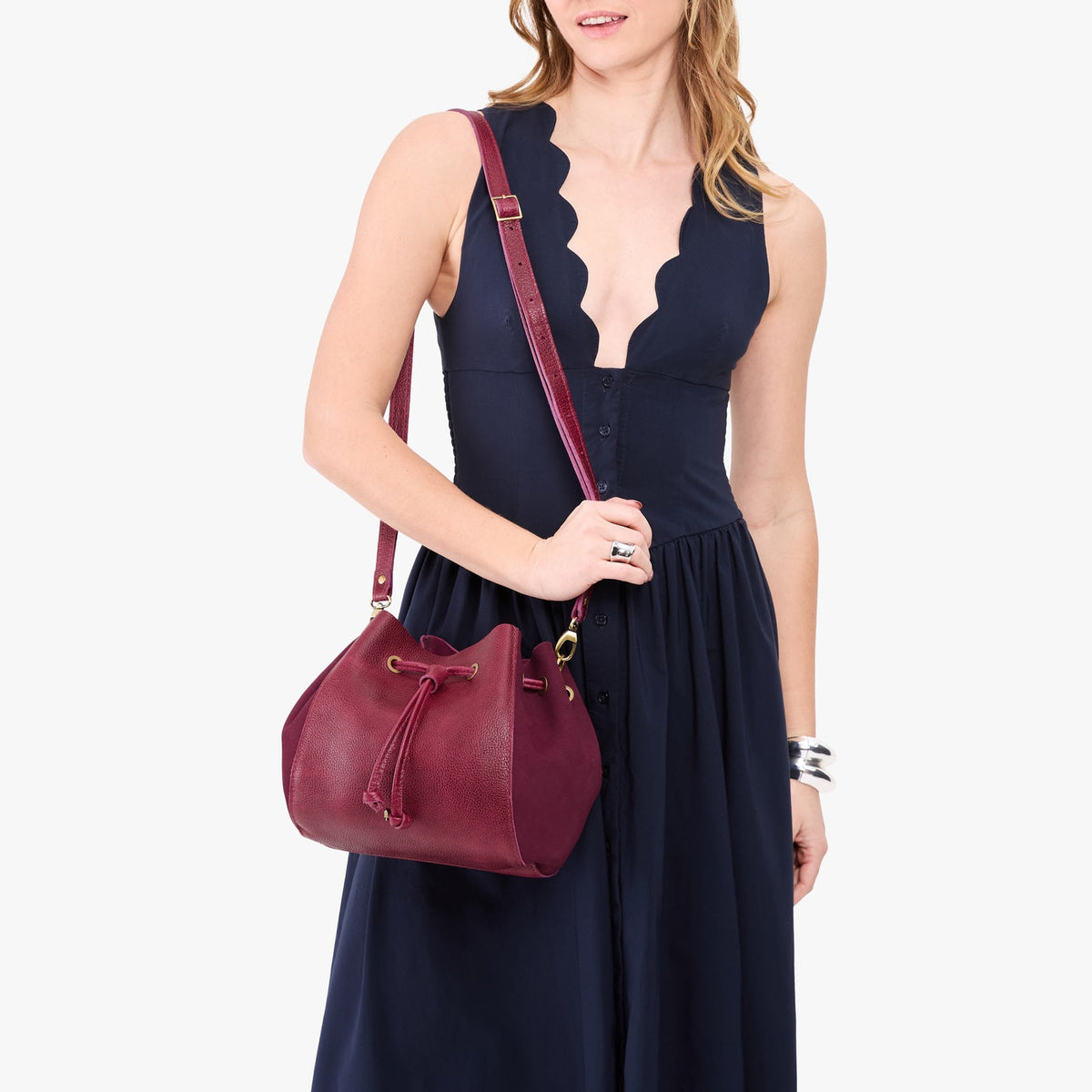 Orchid | Model wearing bucket bag with cinched drawstring closure