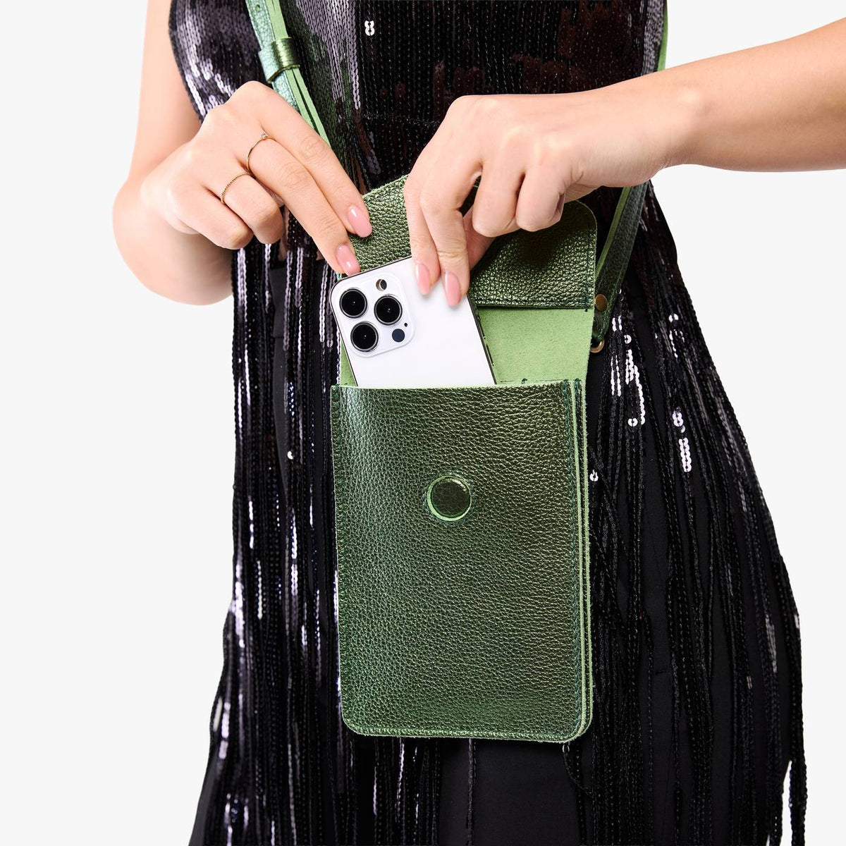 Metallic Greench | Model wearing slim, phone-shaped crossbody purse with magnetic closure