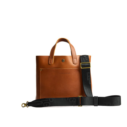 Black | Black strap with repeating PLG letter pattern and brass-toned hardware