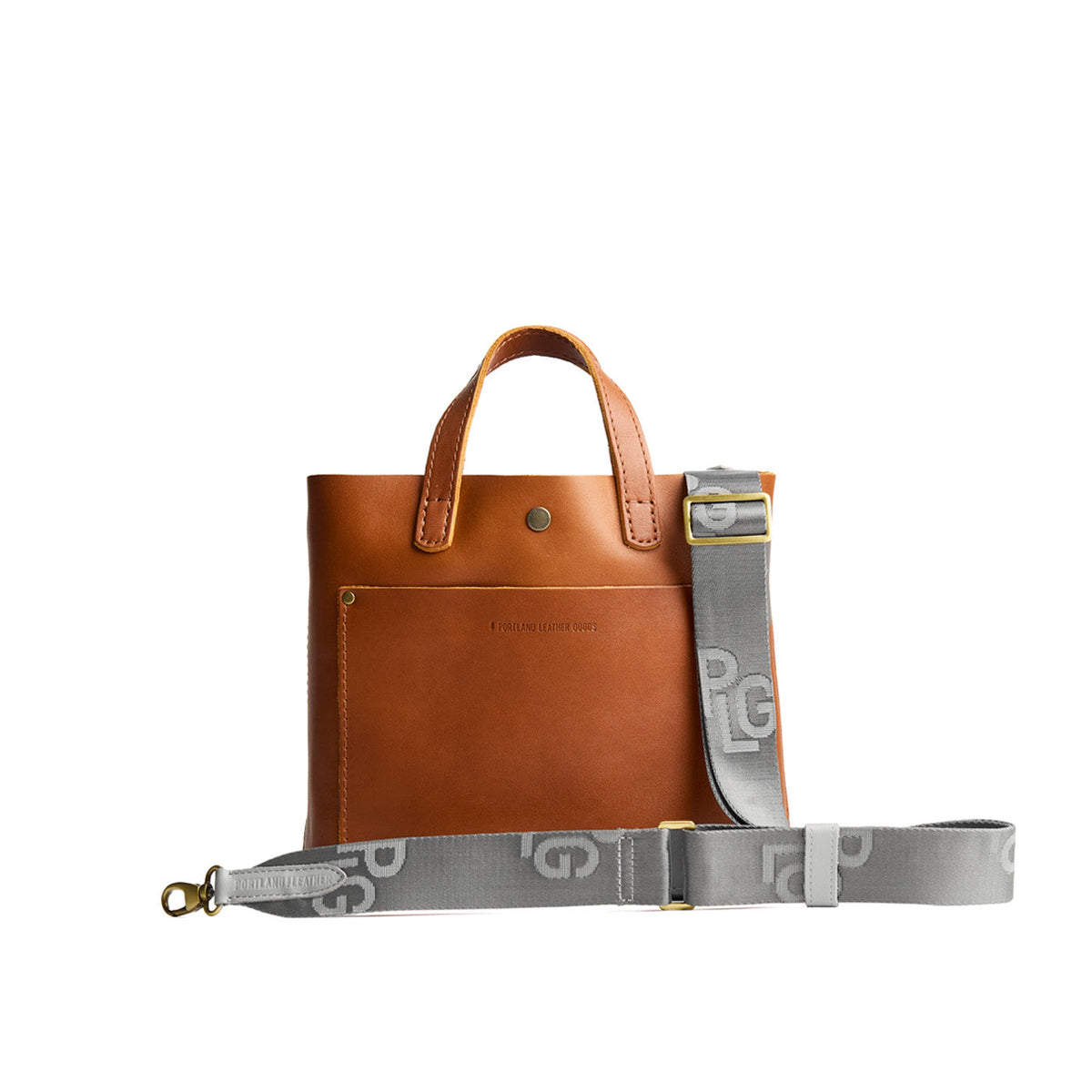 Stone Mist | Grey strap with repeating PLG letter pattern and brass-toned hardware