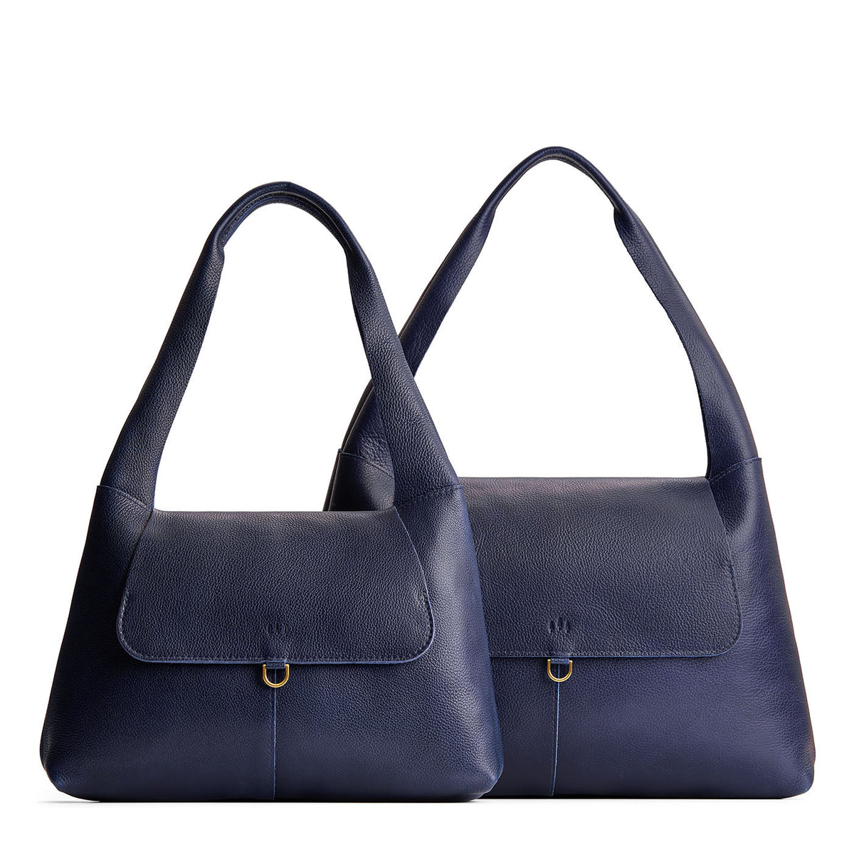 Cobalt | Comparison image of a slouchy triangle shaped shoulder bag with a flap