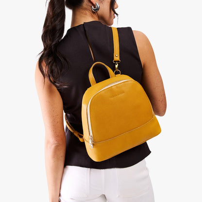 Sunshine | Model wearing leather backpack sling bag style