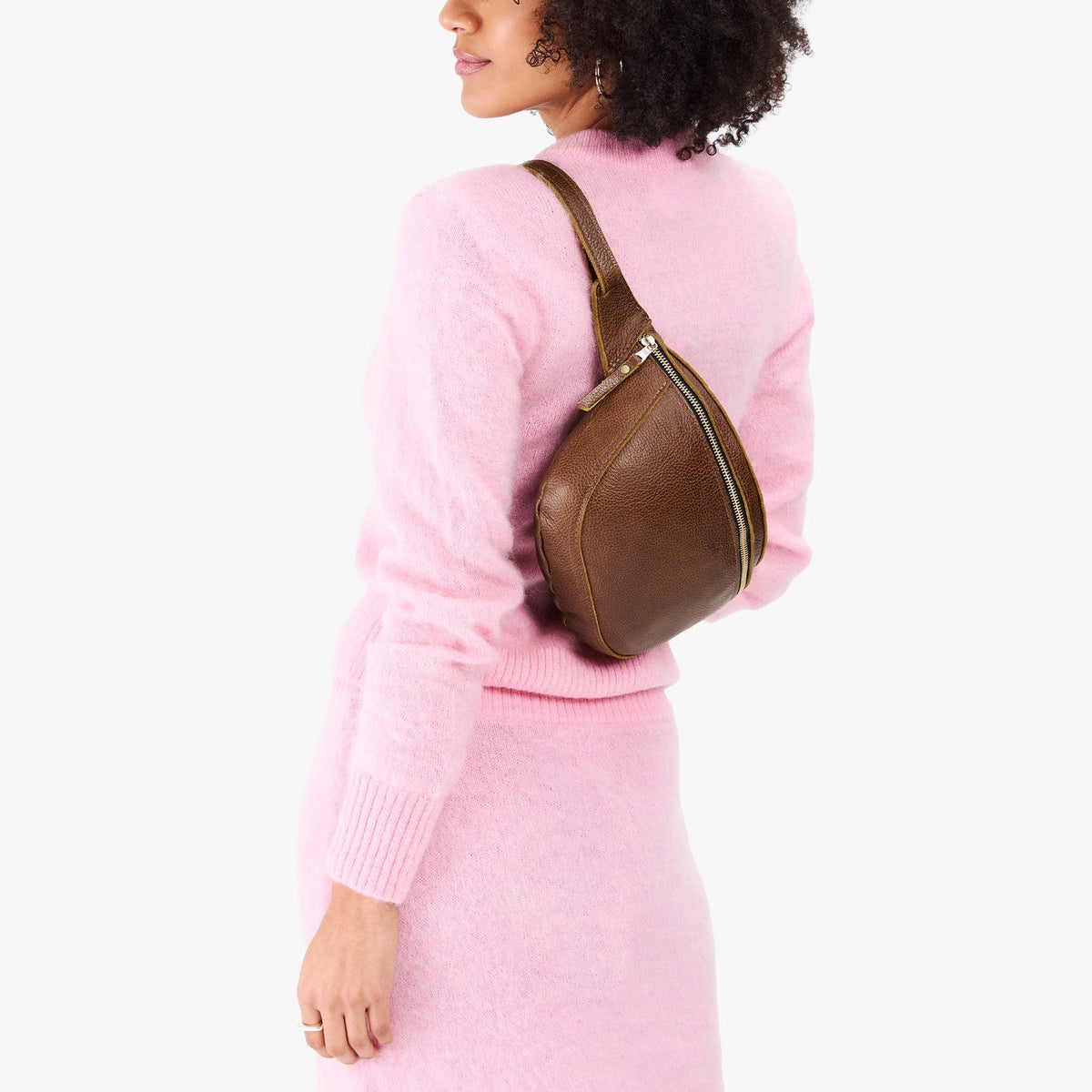 Asheville | Model wearing a sling bag with front zipper