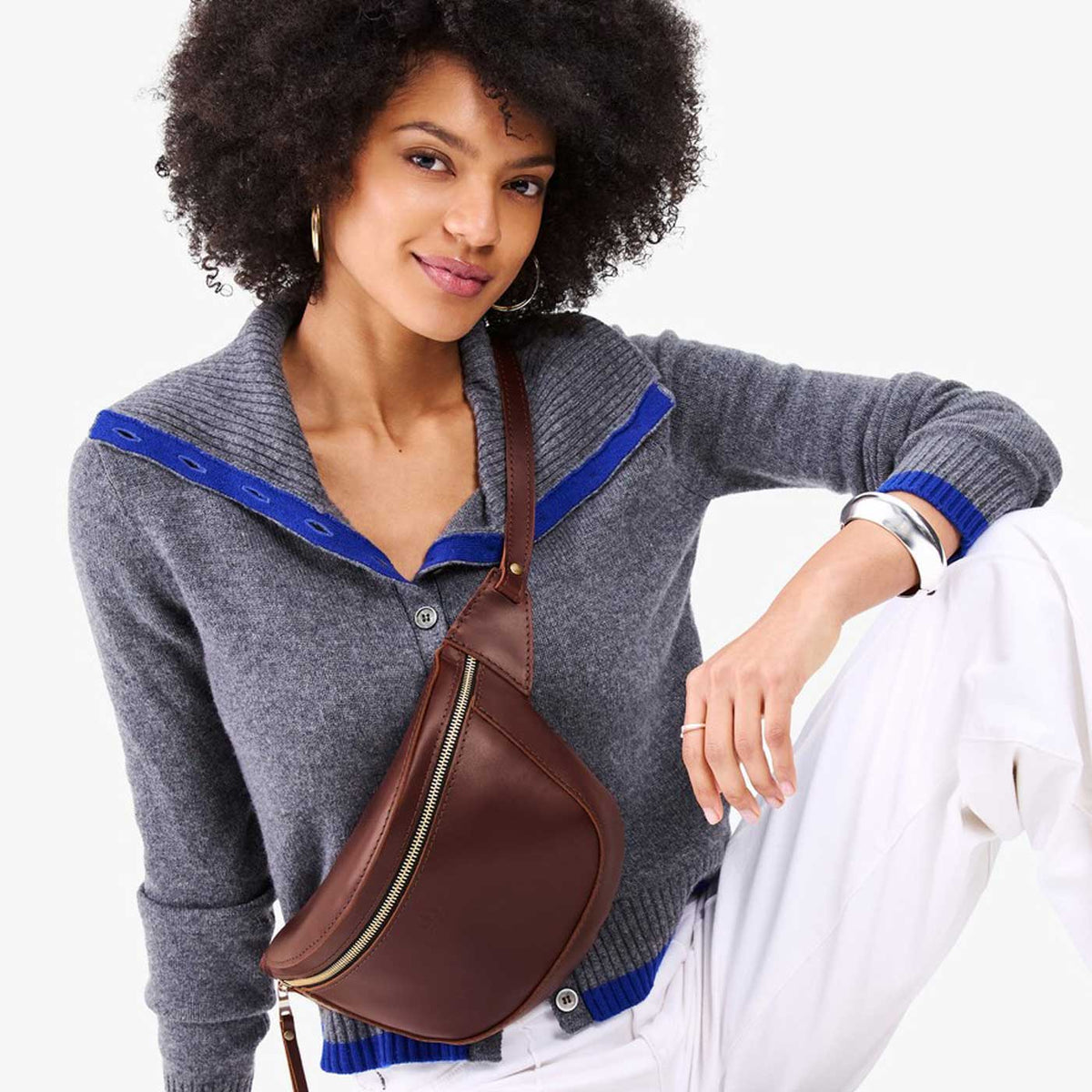 Cognac | Model wearing a sling bag with front zipper