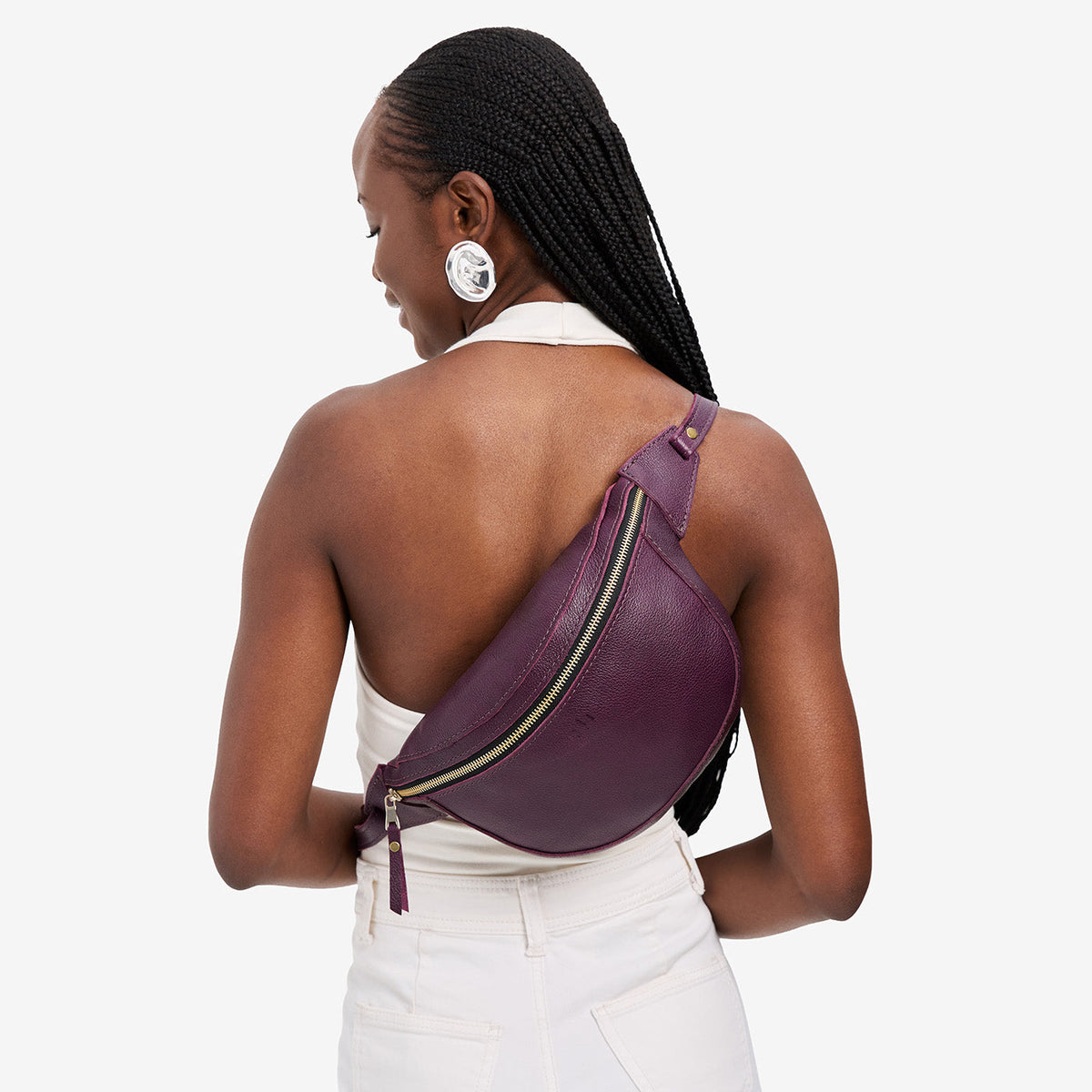 Plum | Model wearing a sling bag with front zipper