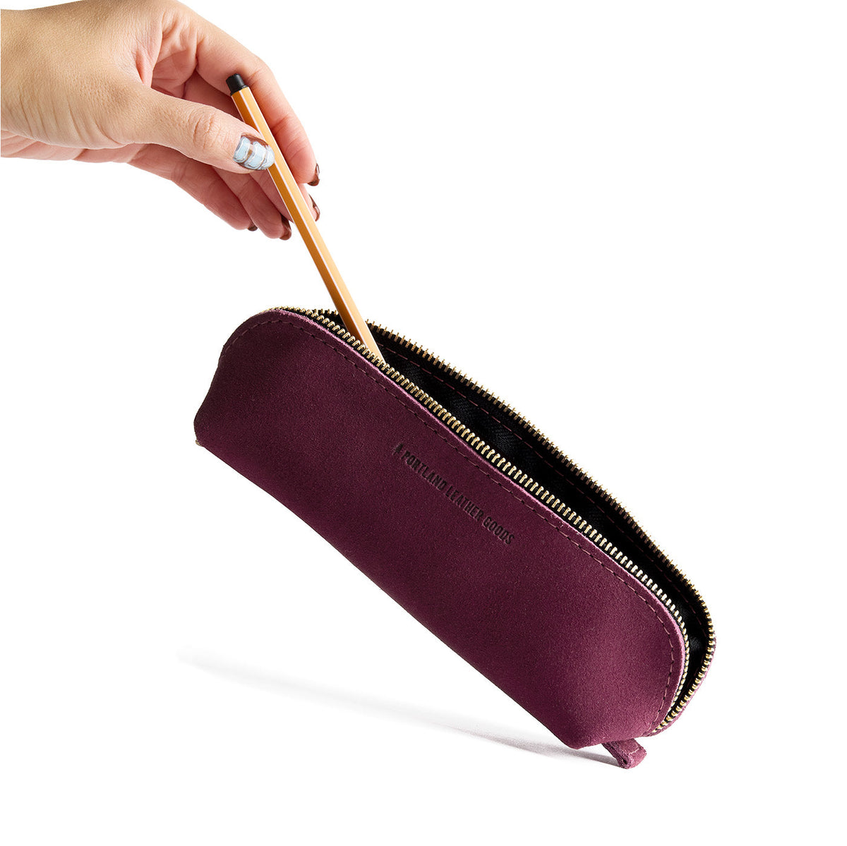 Superbloom | Leather pouch with curved seams and top zipper