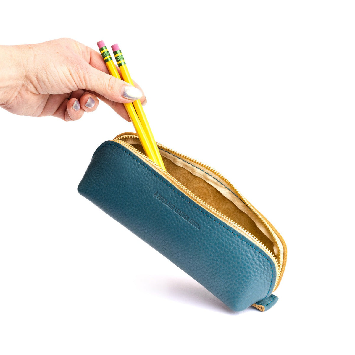 Turquoise | Leather pouch with curved seams and top zipper