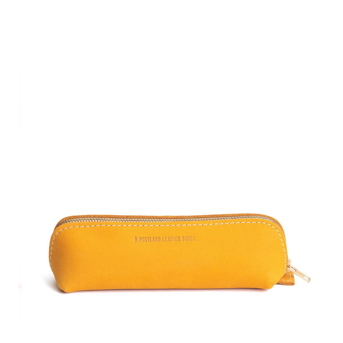 All Color: Turmeric | Leather pouch with curved seams and top zipper