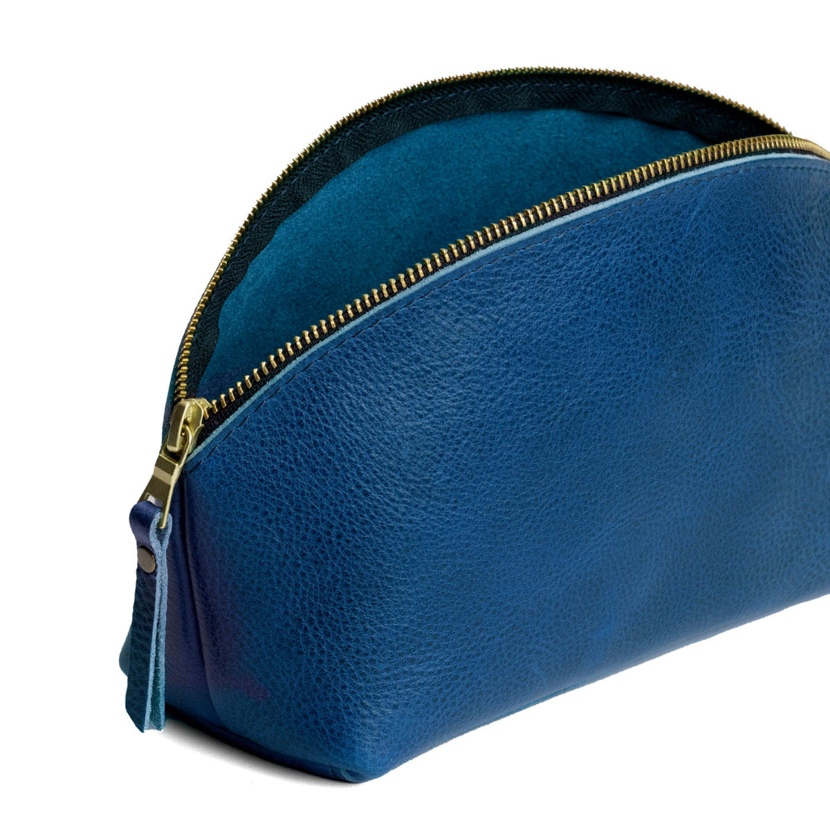 Caspian | Spacious leather makeup bag with curved seams and top zipper open