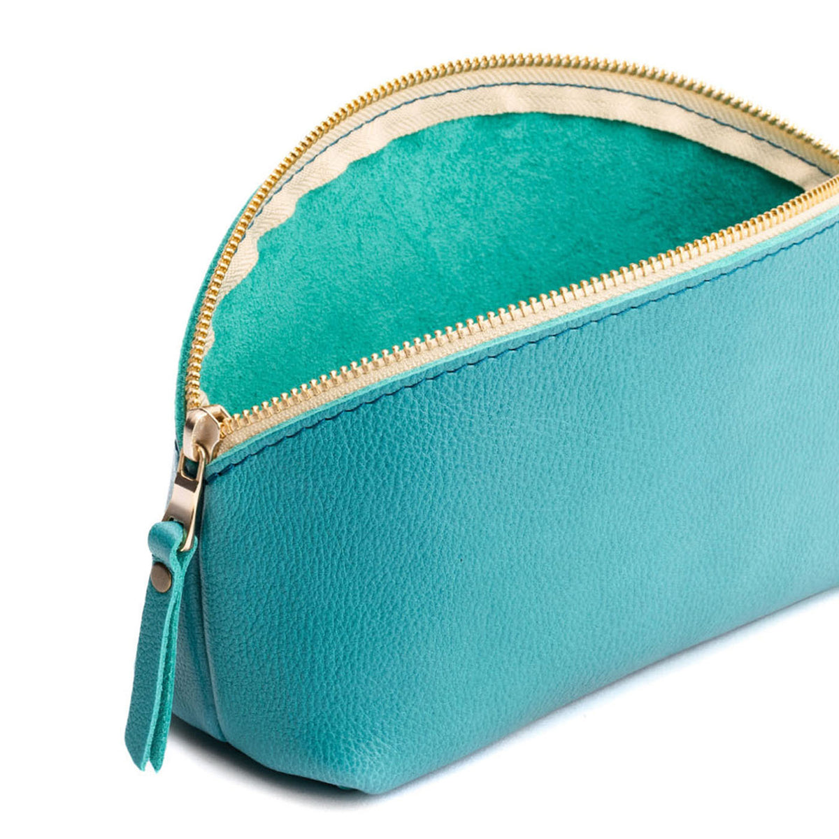 Seafoam | Spacious leather makeup bag with curved seams and top zipper open