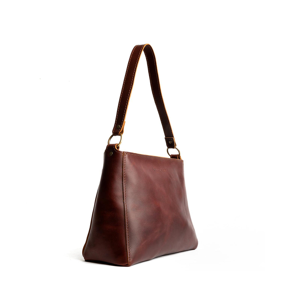 Cognac*Small | Triangular shoulder bag with antiqued brass finished hardware