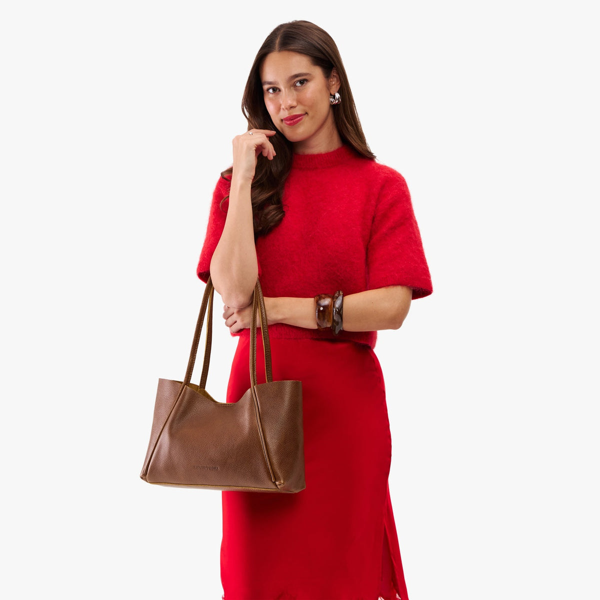 Asheville*Medium | Woman in a red outfit holding wide tote with leather straps and snap closure